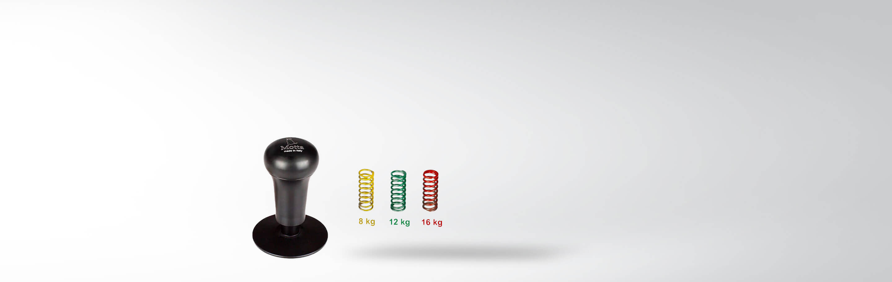 Mechanischer Espresso-Tamper von Motta mit drei austauschbaren Federn in verschiedenen Stärken: 8 kg, 12 kg und 16 kg.