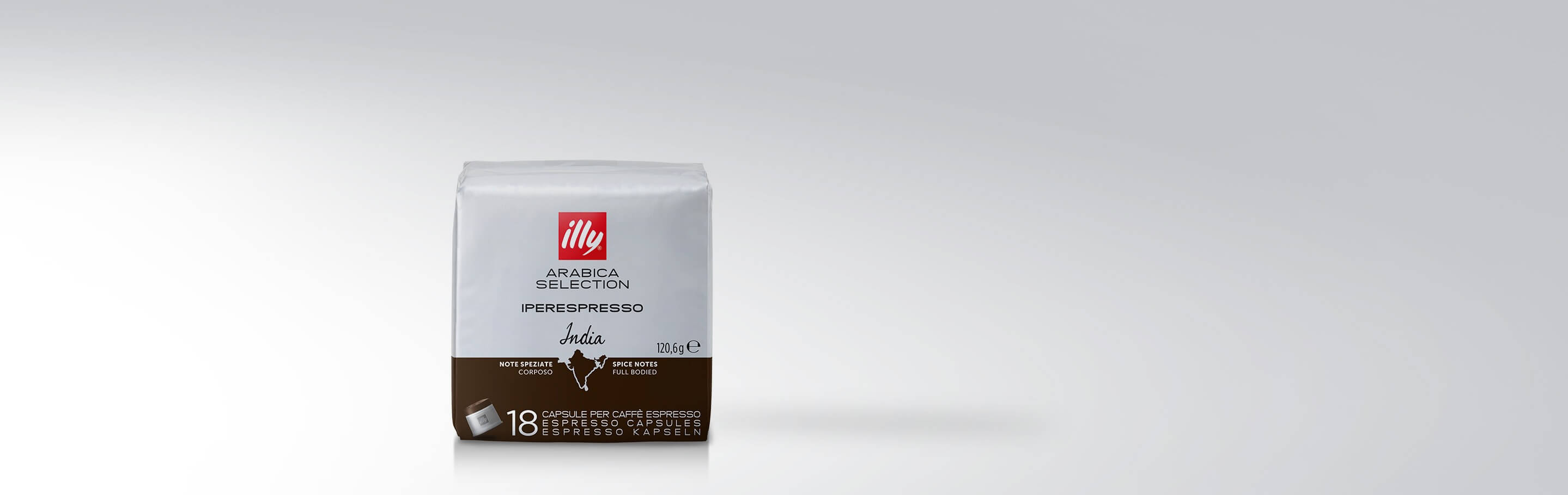 Verpackung von illy Arabica Selection Iperespresso Kapseln Indien mit 18 Kapseln, zeigt geografische Umrisse von Indien und Hinweise auf würzige, vollmundige Geschmacksnoten.