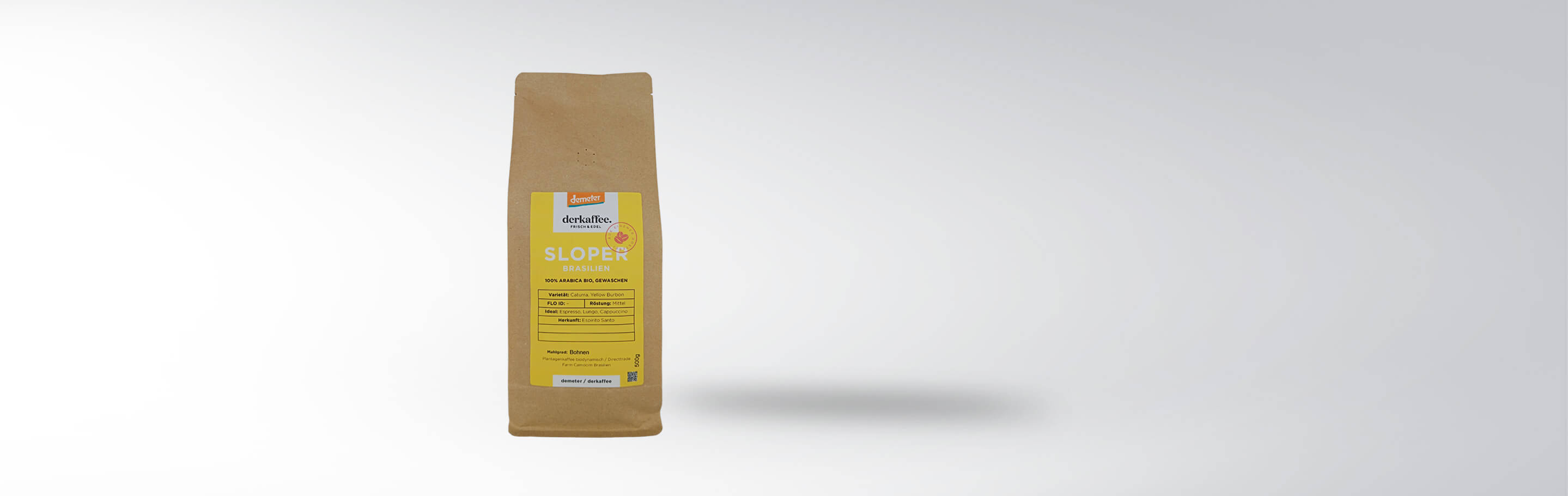 Eine Verpackung des Sloper Brasilien Kaffees von der Kaffeehausmarke, mit 100% Arabica Bio-Bohnen, mittlerer Röstung, geeignet für Espresso und Cappuccino.