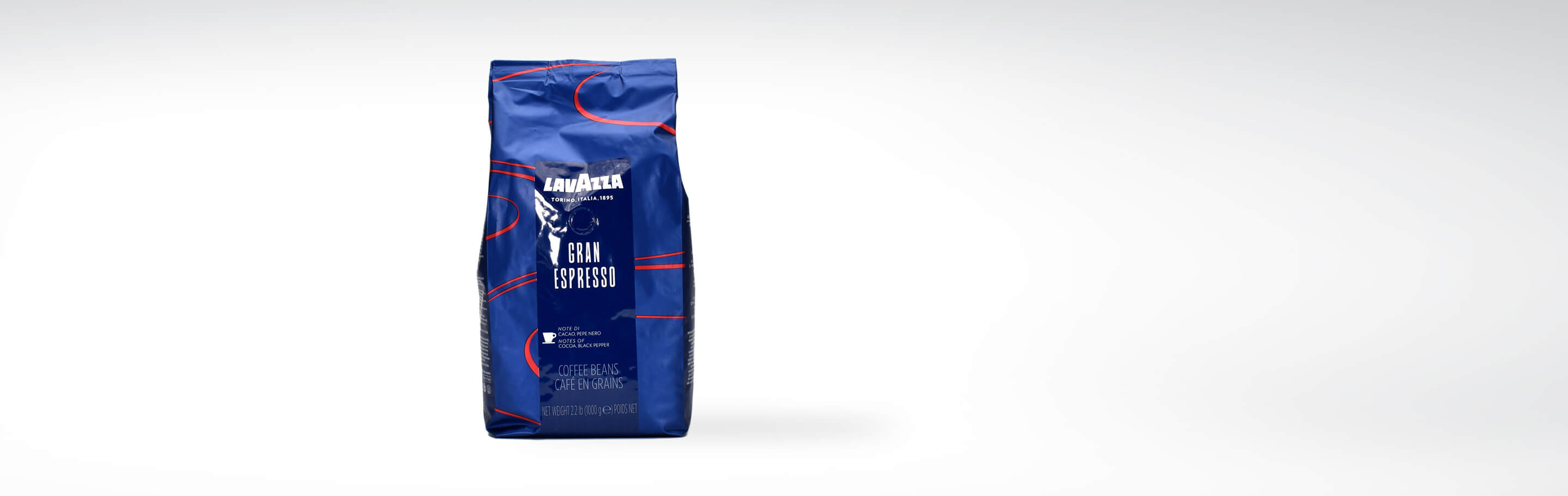 Eine Packung Lavazza Gran Espresso Kaffeebohnen, 1 kg, in blauem Design
