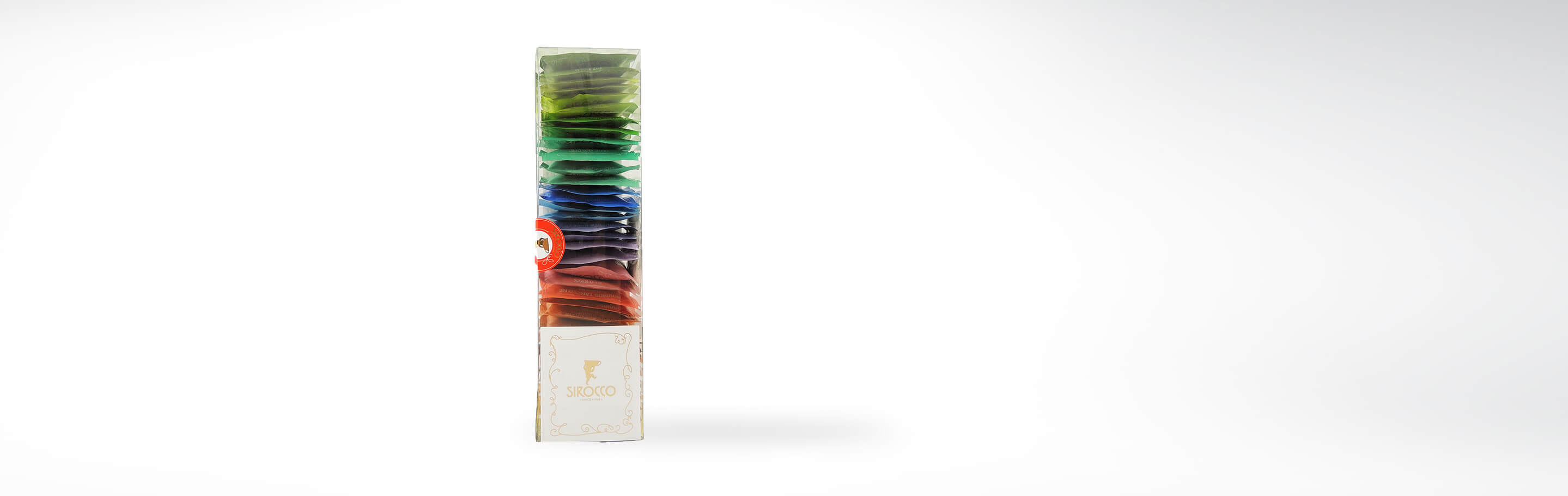 Sirocco Tee Geschenkset mit verschiedenen farbigen Teebeuteln in transparenter Verpackung sichtbar dargestellt