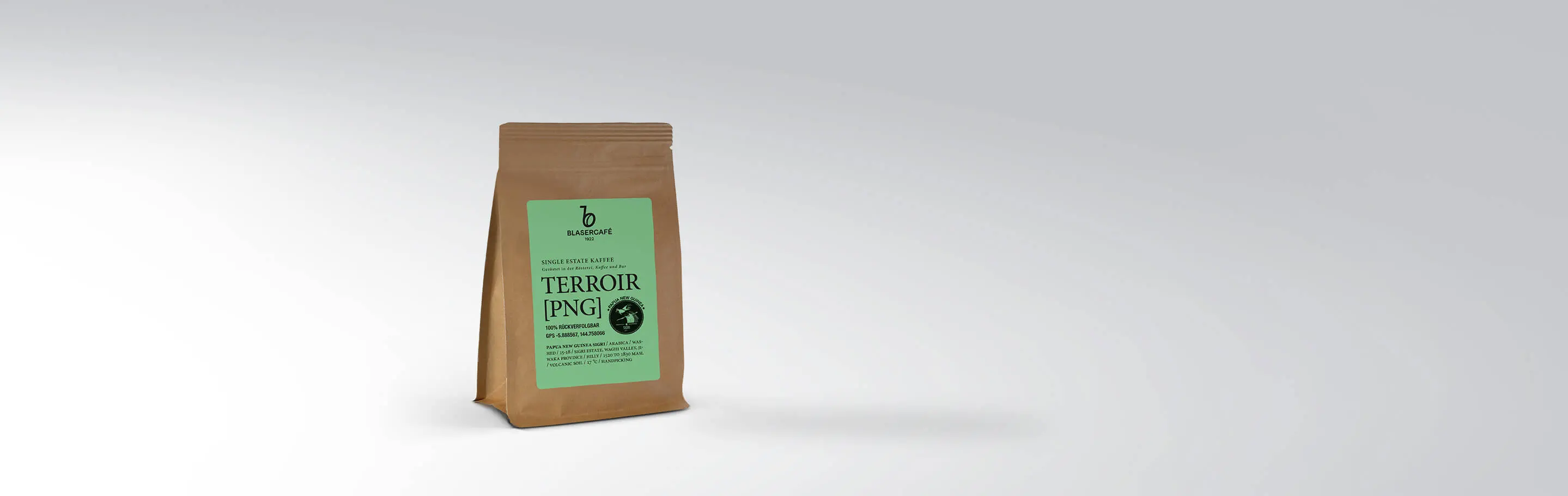 Verpackung des Blasercafé Terroir PNG Single Estate Kaffees in einer braunen Tüte mit grünem Etikett, 250g