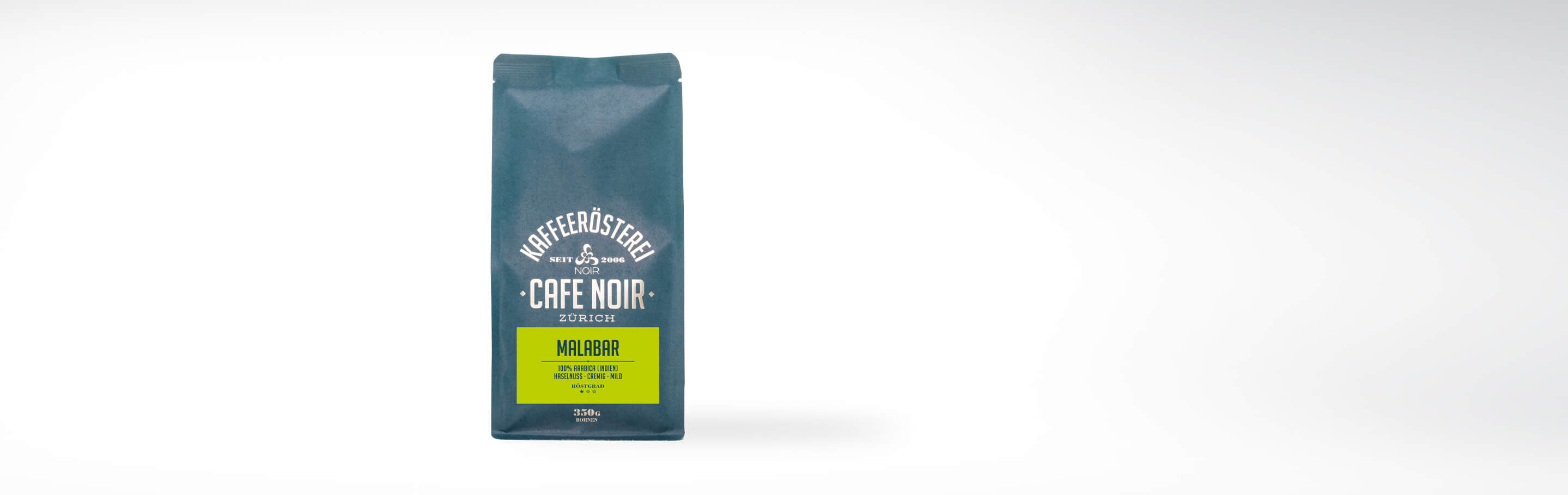 Eine Packung Café Noir Malabar Kaffee aus Zürich, 250g, 100% Arabica-Bohnen aus Indien mit einem milden, cremigen Haselnussgeschmack.