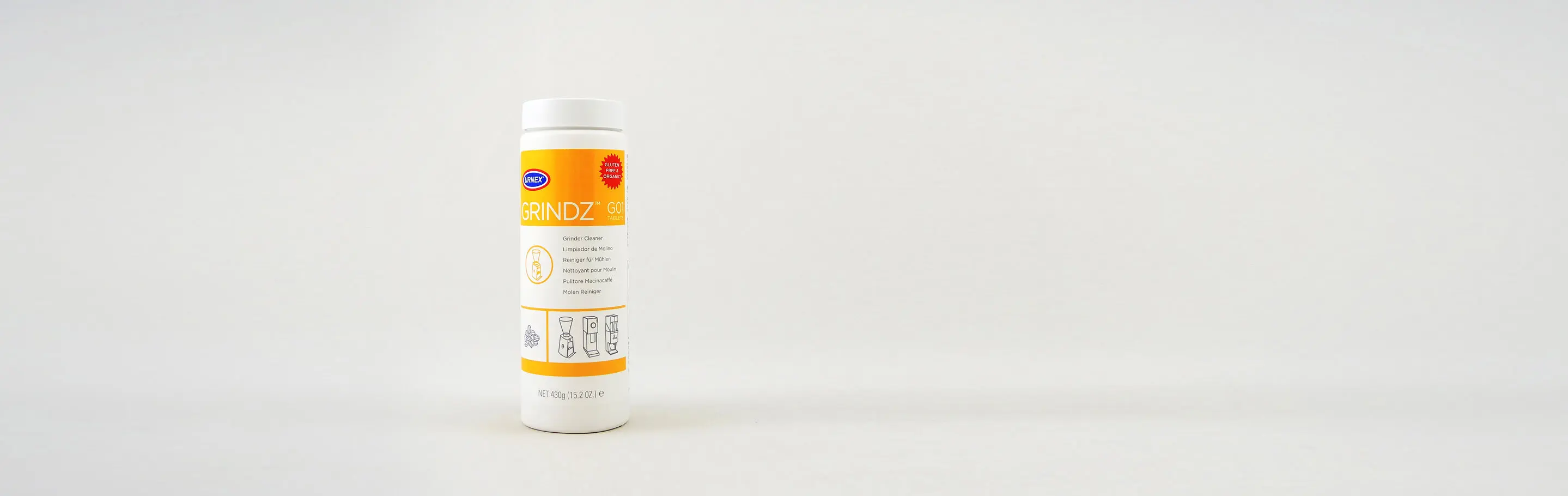 Urnex Grindz Kaffeemühlenreiniger in weißer Flasche mit orangefarbenem Etikett, 430 Gramm