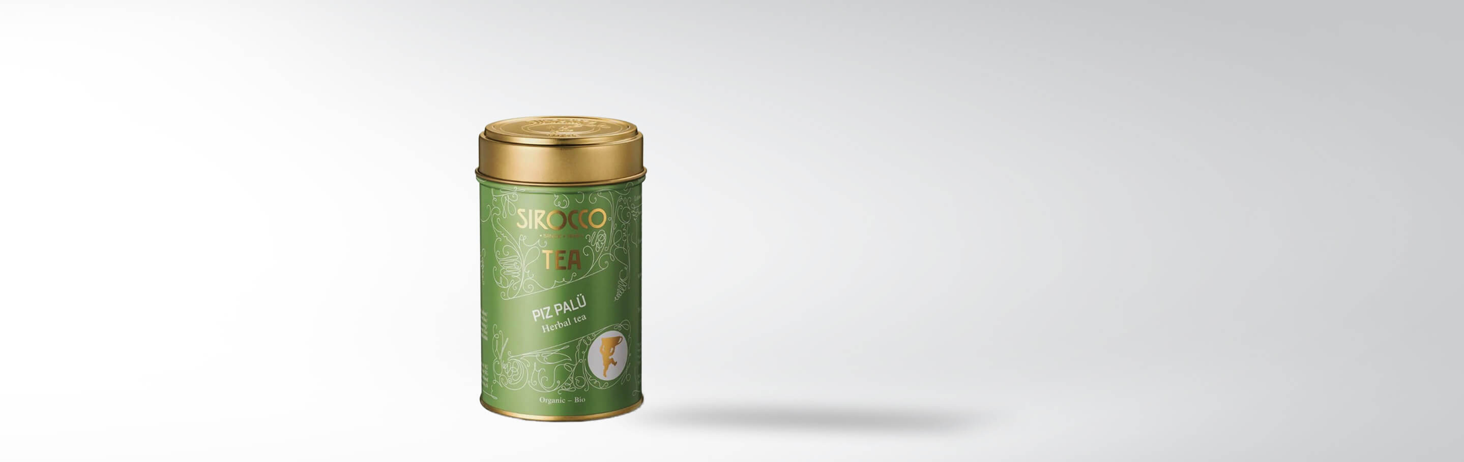 Grüne Teedose von Sirocco mit der Aufschrift Piz Palü, Herbal tea, Organic - Bio, auf hellem Hintergrund