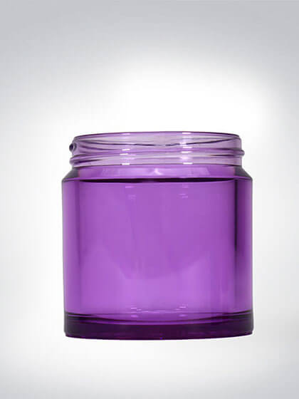 Leerer lila Kunststoffbehälter vor grauem Hintergrund