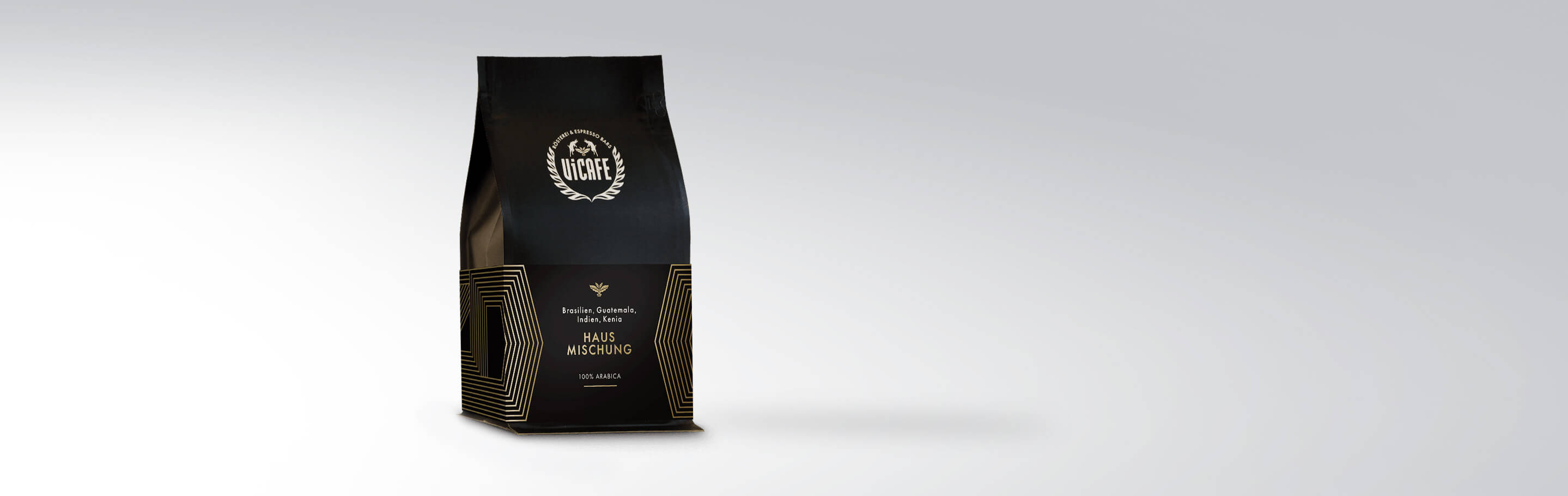 Verpackung der Kaffee Hausmischung 100% Arabica, hergestellt aus Bohnen aus Brasilien, Guatemala, Indien und Kenia