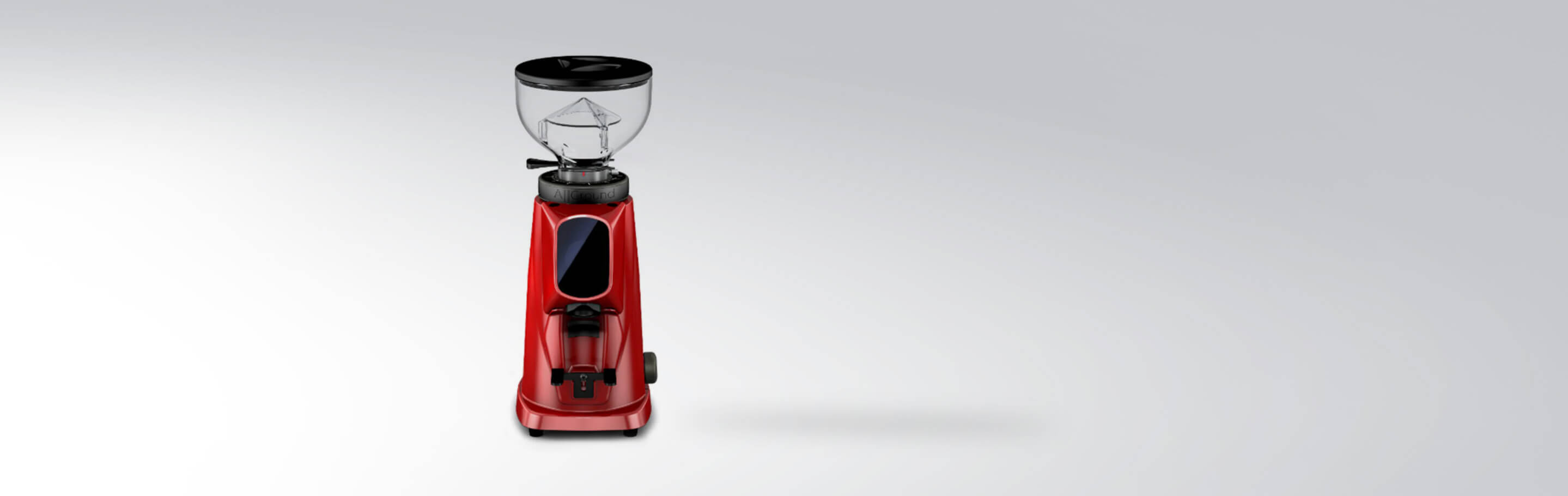 Rote Kaffeemühle auf hellem Hintergrund