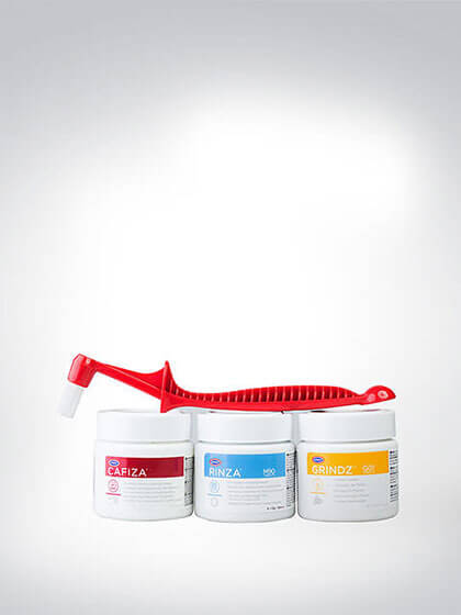 Reinigungsset bestehend aus Cafiza Reinigungspulver, Rinza Milchsystemreiniger, Grindz Mühlenreiniger und einer Reinigungsbürste